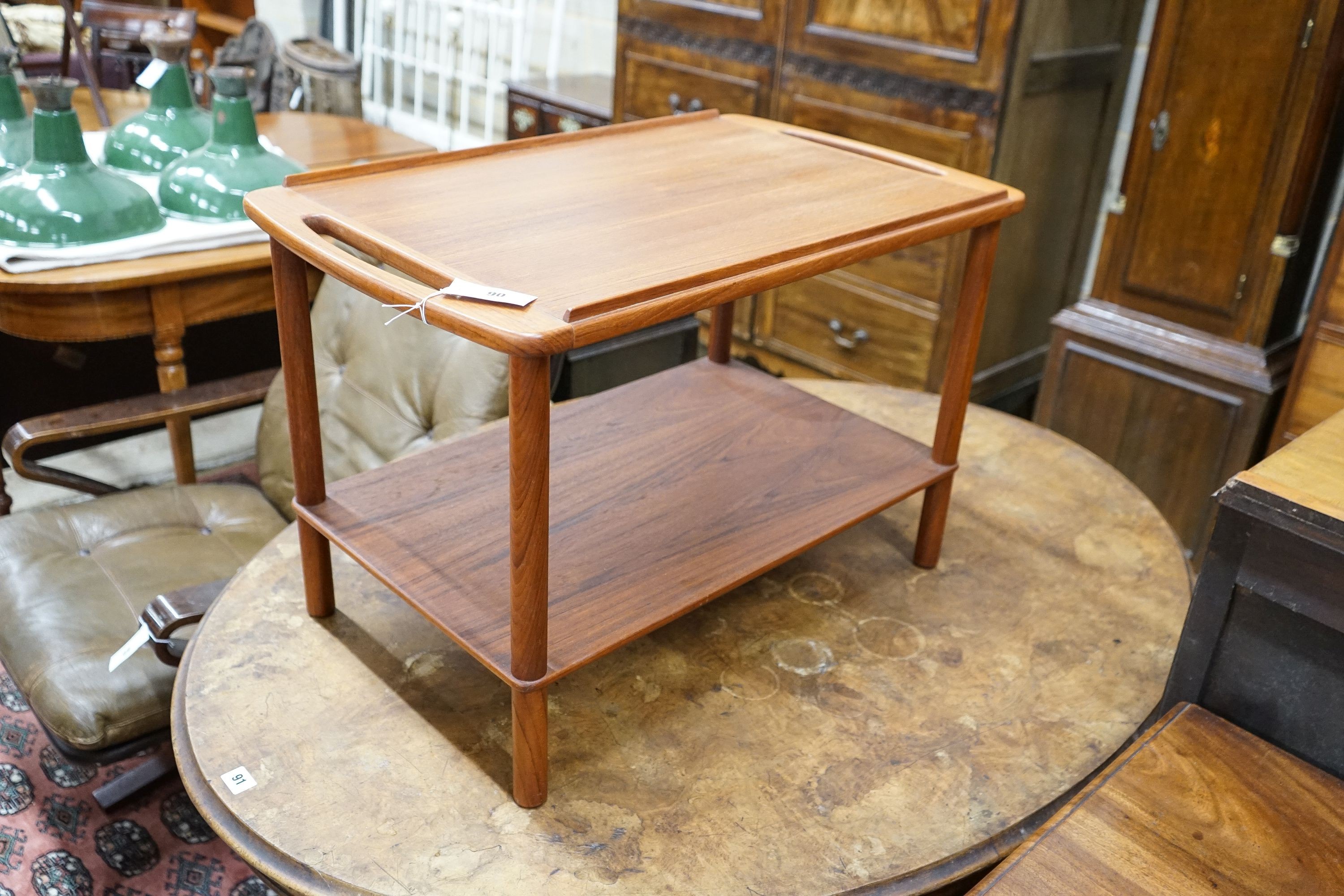 A mid century design Danish style teak two-tier occasional table, width 74cm, depth 44cm, height 48cm